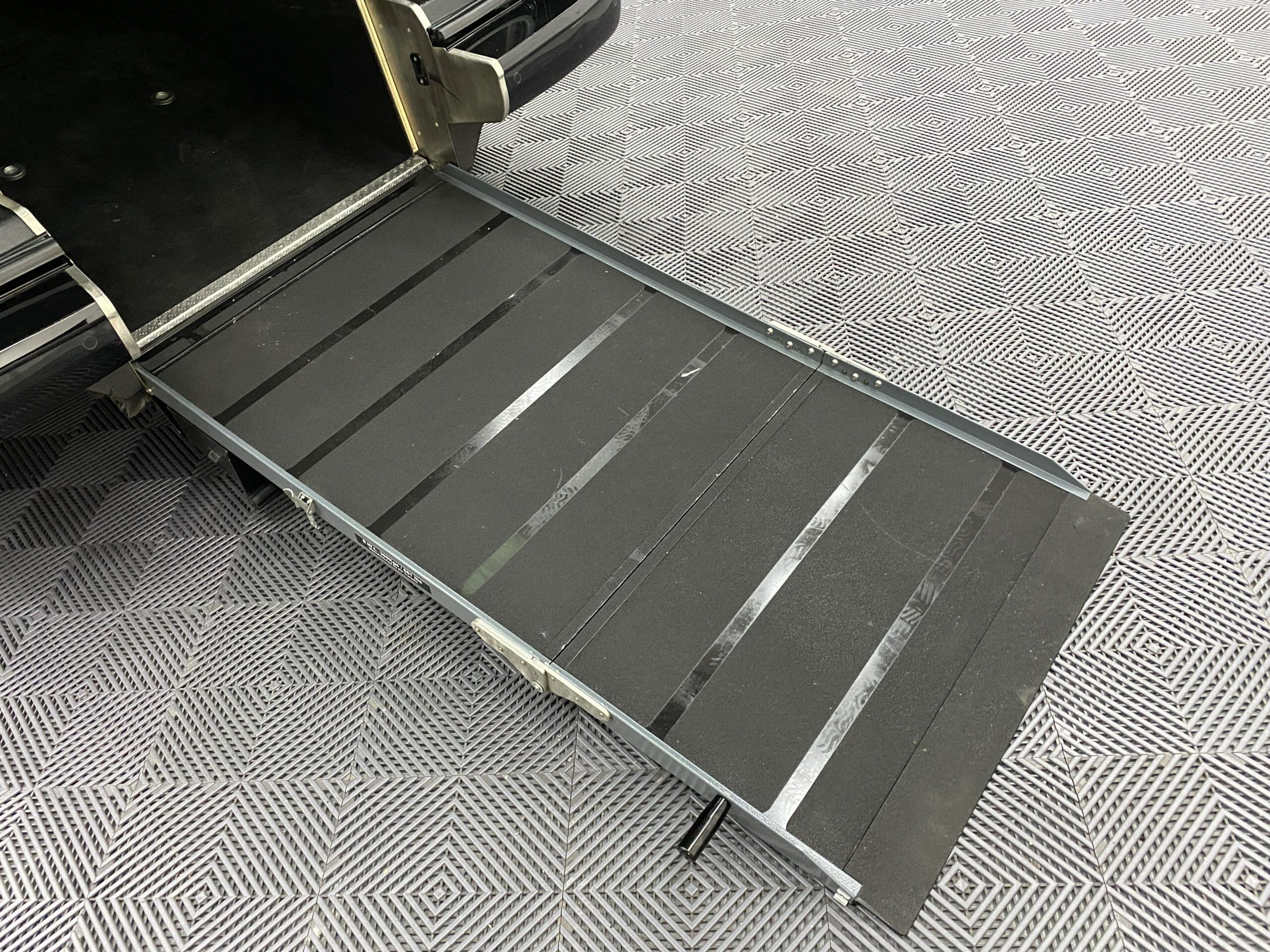 Volkswagen Transporter T6.1 Automatic Wheelchair accessible vehicle rear ramp in the deployed position YB21VXV