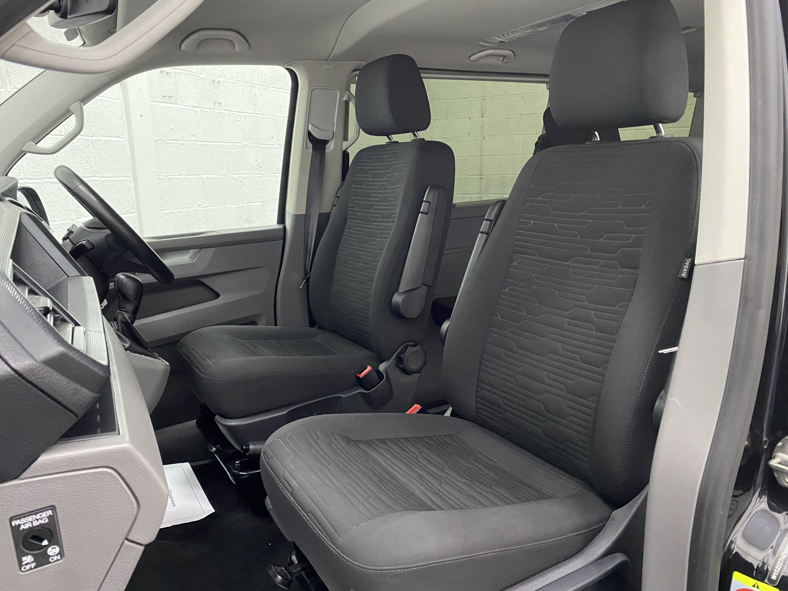 Twin single front seats on a 2021 Volkswagen Transporter T6.1 automatic wheelchair accessible vehicle YB21 VXV