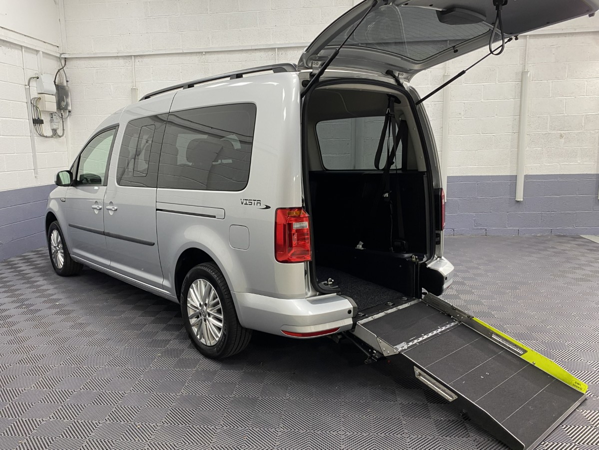 Volkswagen Caddy Maxi wheelchair accessible vehicle rear three quarter view with rear ramp deployed SB21UOH