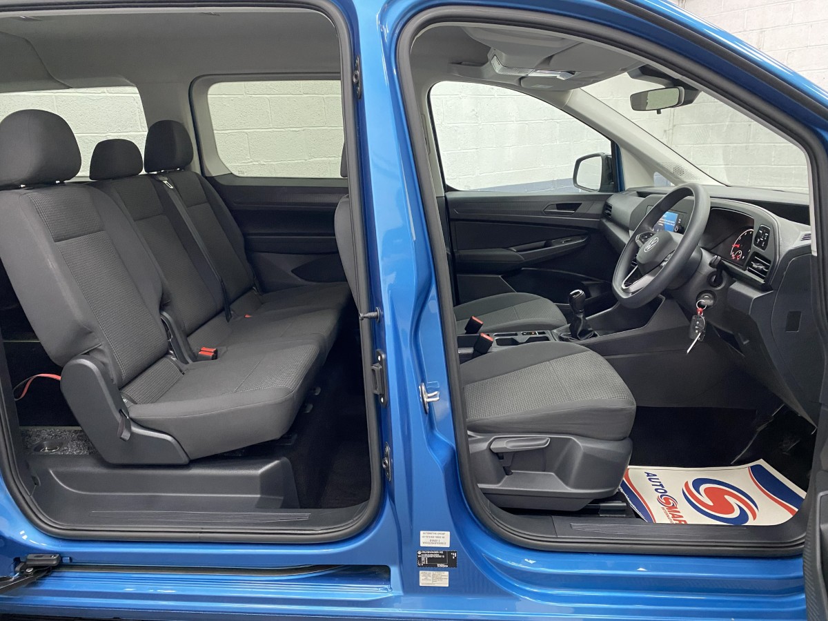 2022 Volkswagen Caddy Maxi Petrol wheelchair accessible vehicle interior view from side showing both front and rear seats NK72AUL