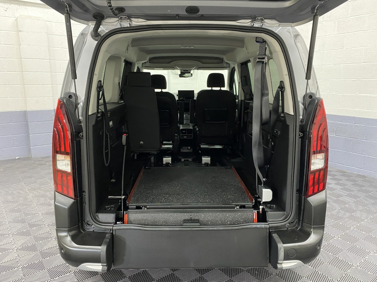 A Peugeot Rifter LWB Automatic Wheelchair Accessible Vehicle rear wheelchair ramp in the fold flat position SB24MJY
