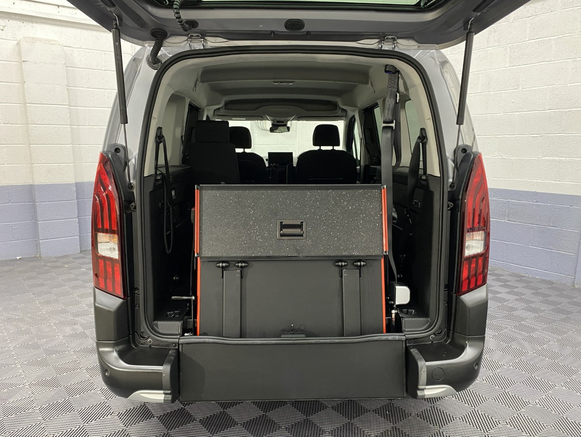 A Peugeot Rifter LWB Automatic Wheelchair Accessible Vehicle rear wheelchair ramp in the stored position SB24MJY