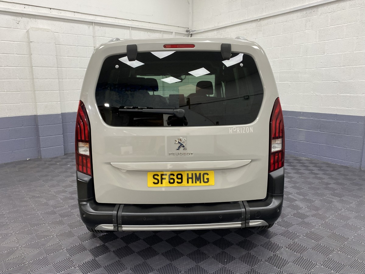 Rear view of a Peugeot Rifter wheelchair accessible vehicle with tailgate closed SF69HMG