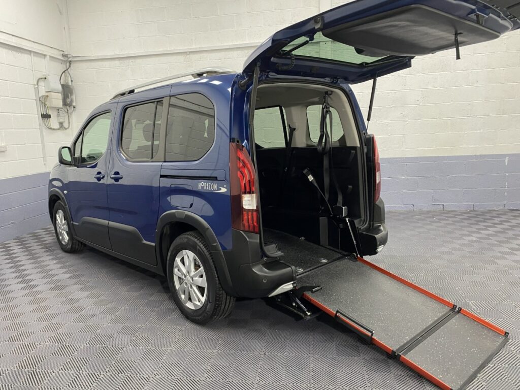 Peugeot Rifter Wheelchair Accessible Vehicle rear three quarter view with rear wheelchair ramp deployed SF69FWS