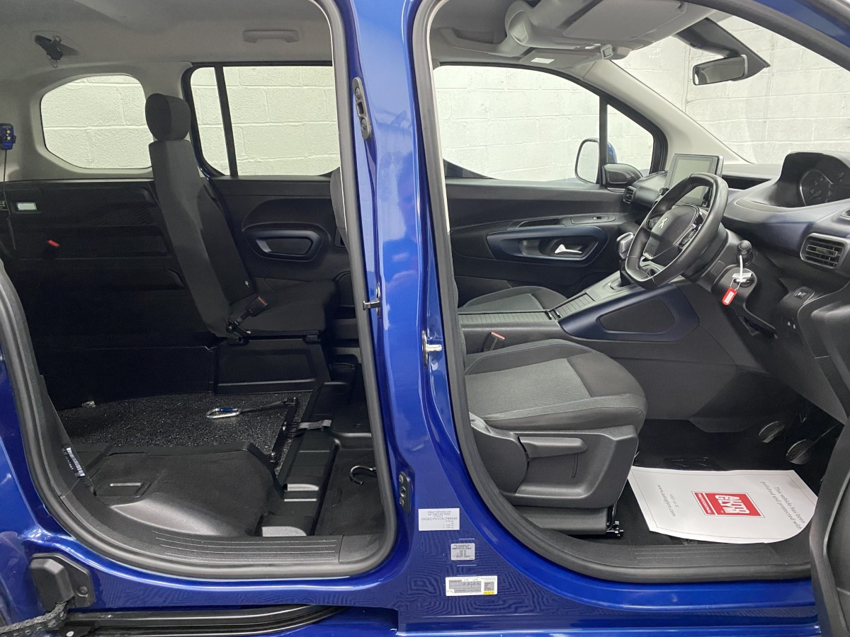 Peugeot Rifter wheelchair accessible vehicle side interior view showing front seats and single rear seat SF69FWS